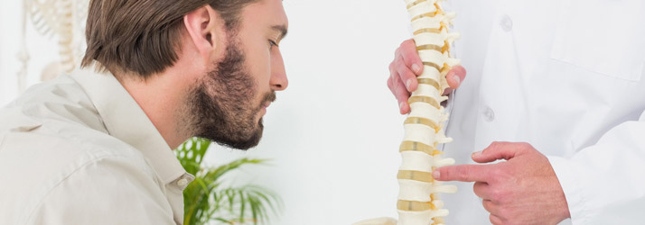 Chiropractic Olathe KS Man Looking At Spine Model