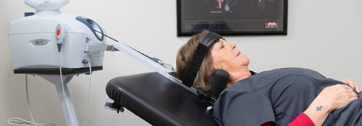 Chiropractic Olathe KS Woman Getting Spinal Decompression Treatment